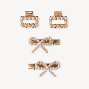 Lote de 2 horquillas con lazo y 2 pinzas con perlas para niña 